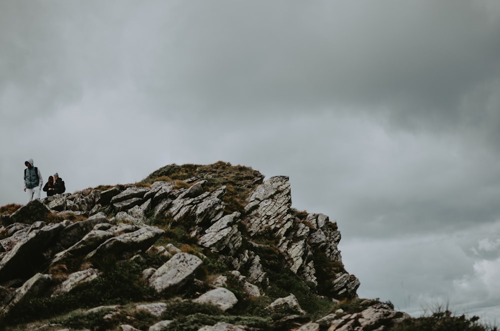 a group of people on a rocky mountain