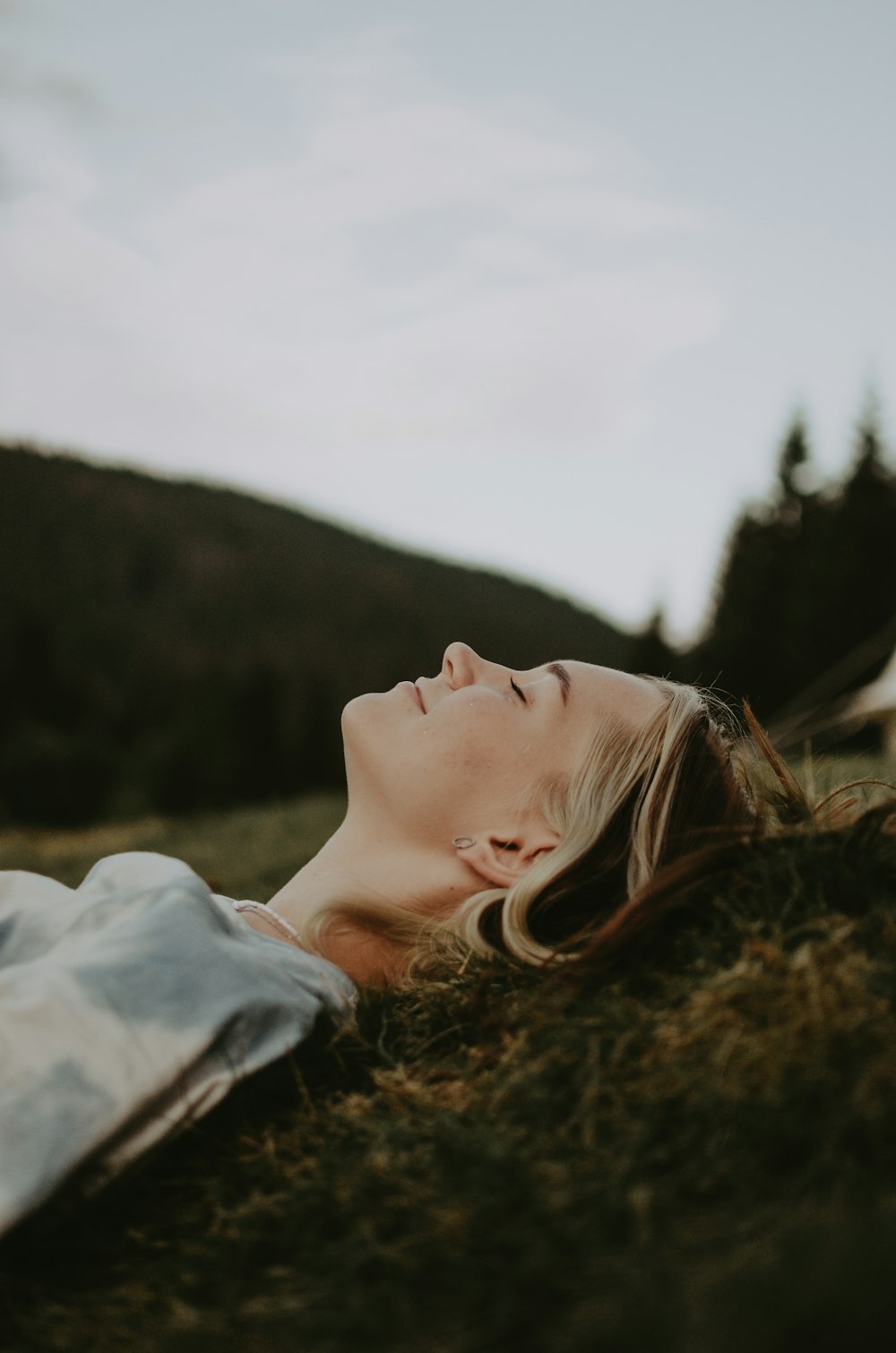 a person lying in the grass