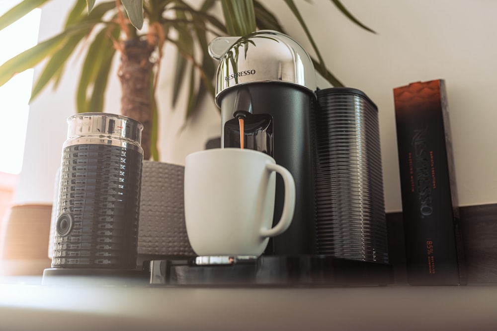 a coffee mug and a stack of books on a table