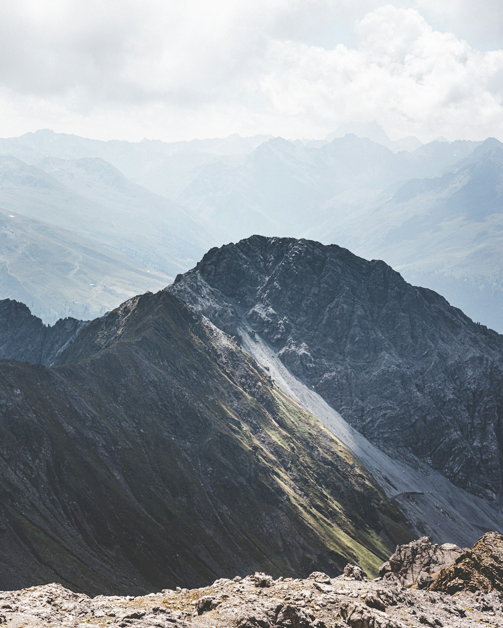 a mountain with a valley below