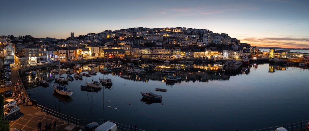 a harbor filled with lots of small boats in a body of water