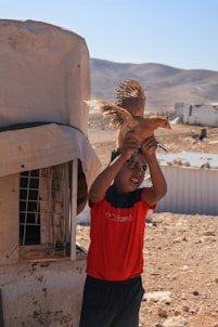 a person holding a bird
