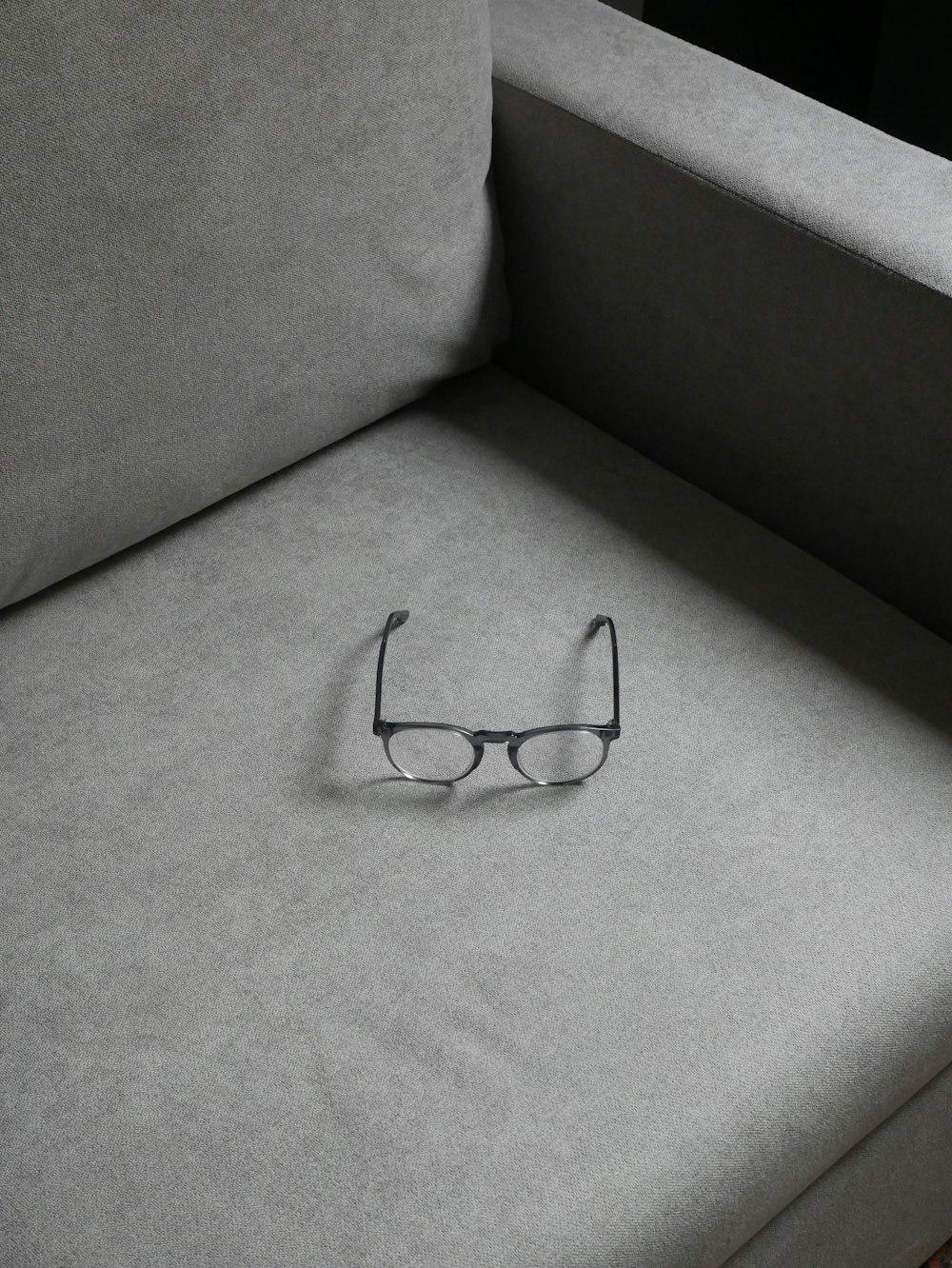 a pair of glasses on a couch