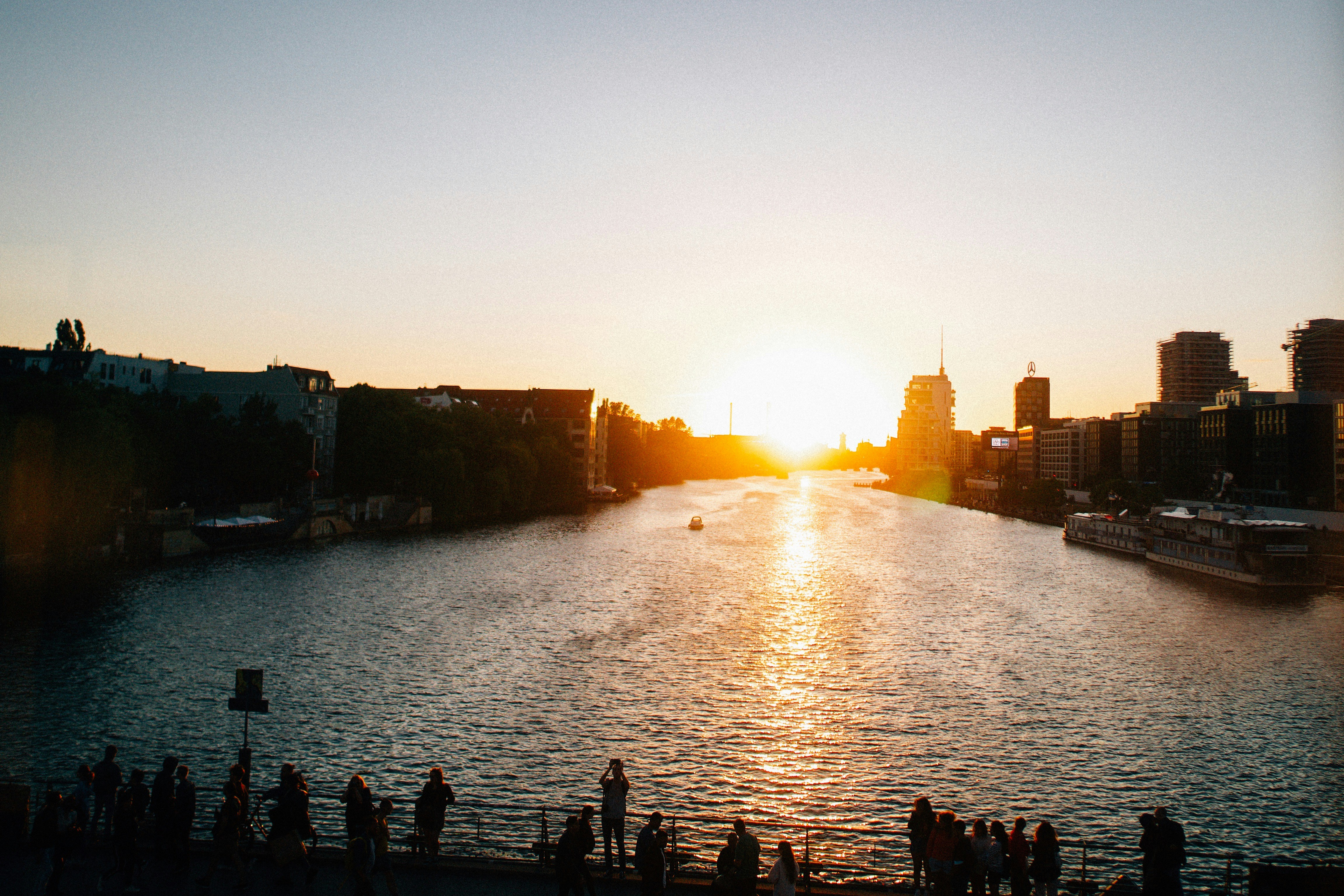 a body of water with a city in the background