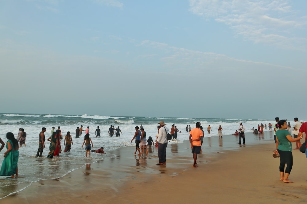 a group of people on a beach with Marina Beach in the background