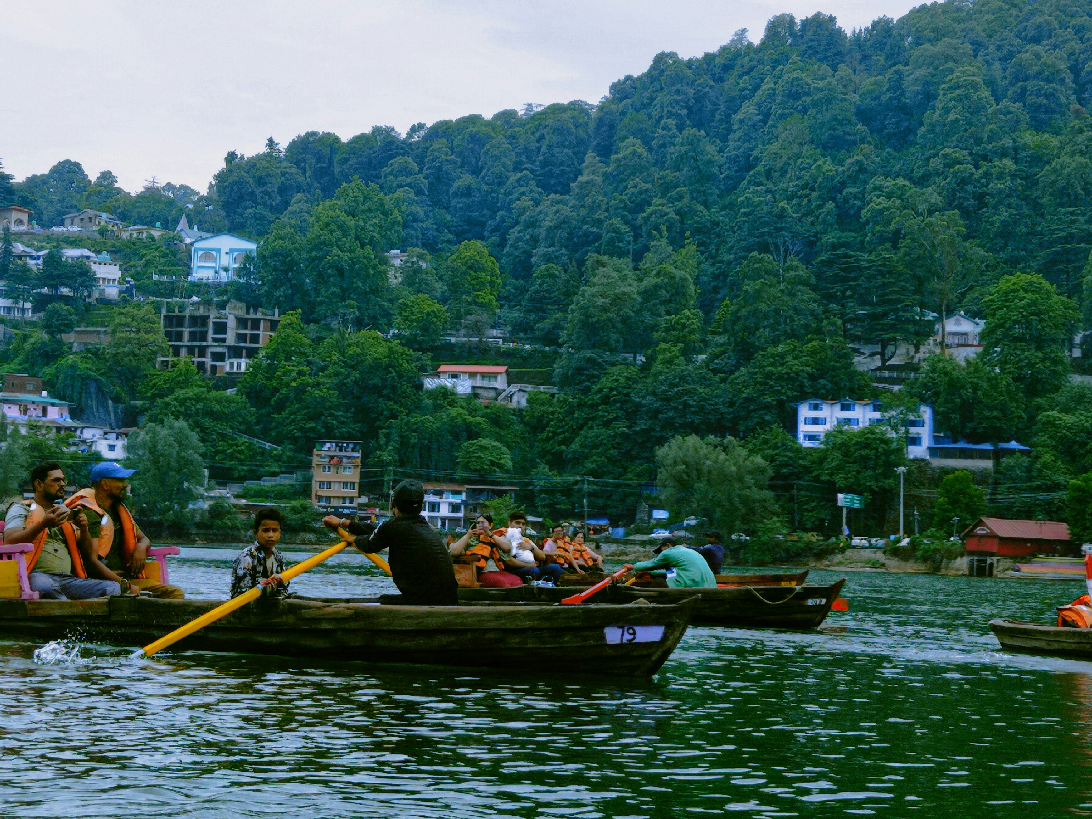 a group of people rowing a boat