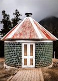 a small building with a red roof
