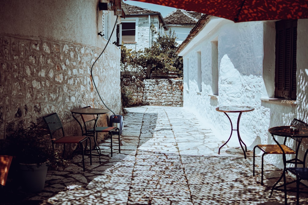 a courtyard with tables and chairs