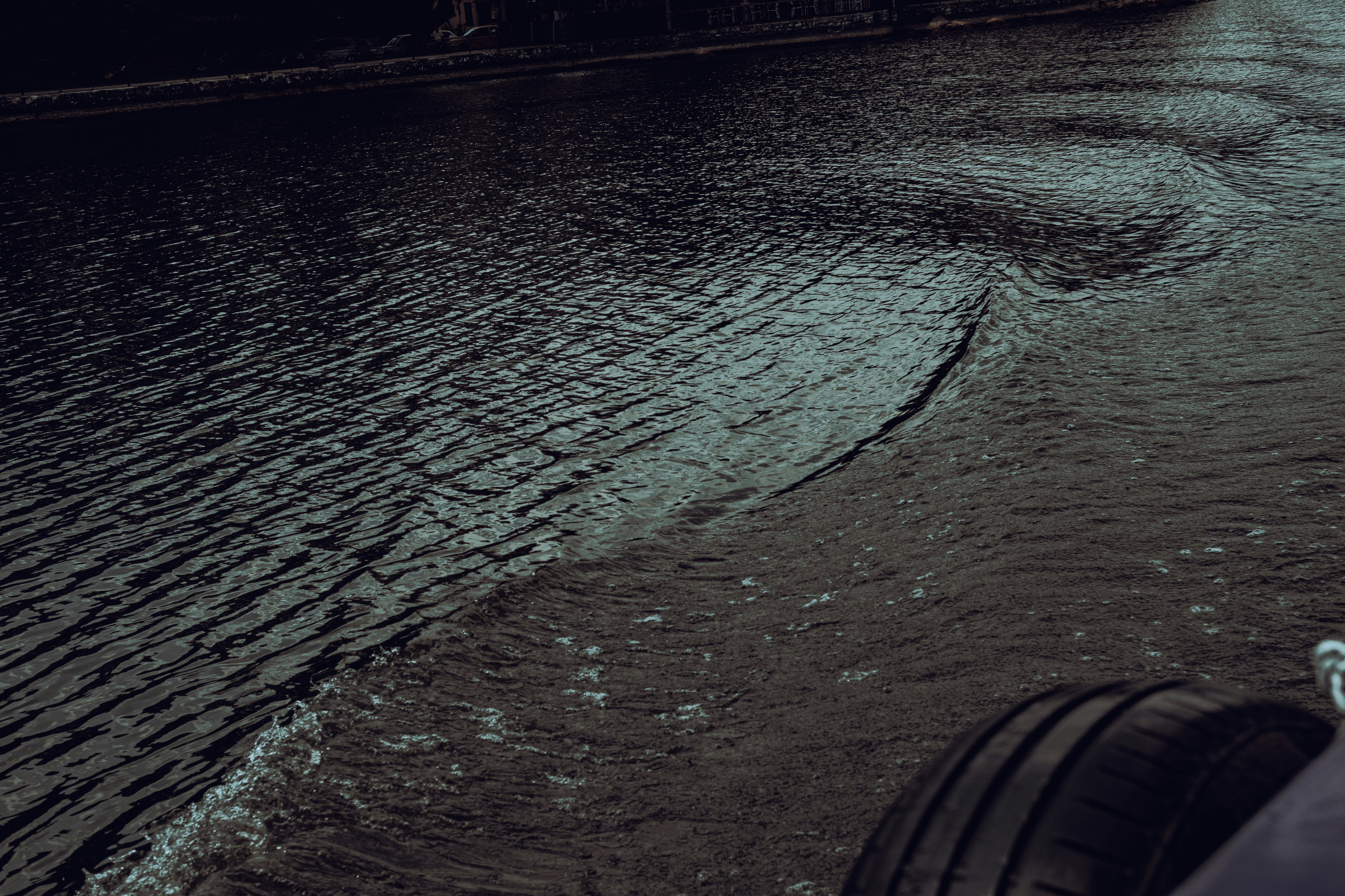 a person's foot on a wet surface