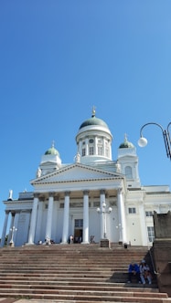 a building with a domed roof and pillars