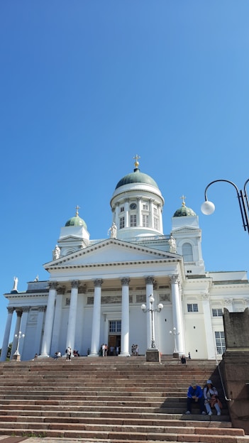 a building with a domed roof and pillars