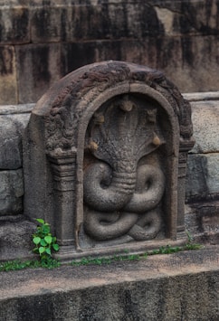 a stone carving of a lion