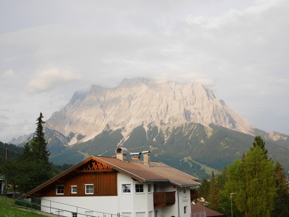 a house with a mountain in the background