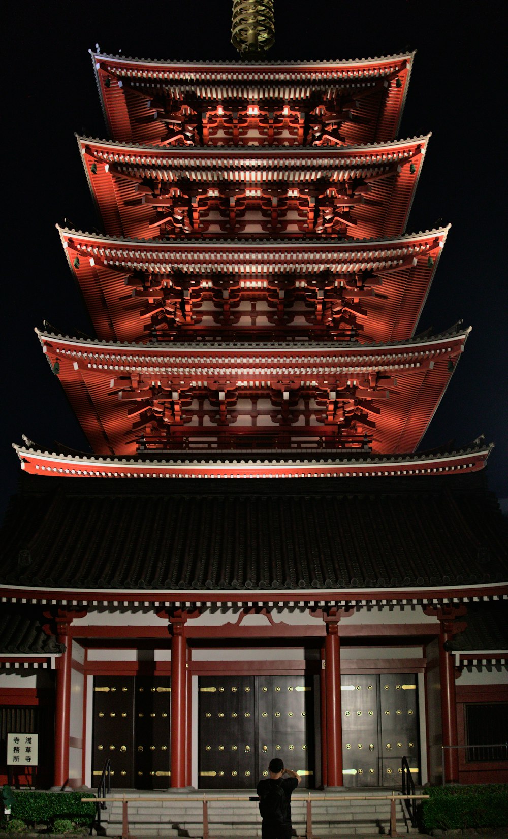 a pagoda with red and black roof