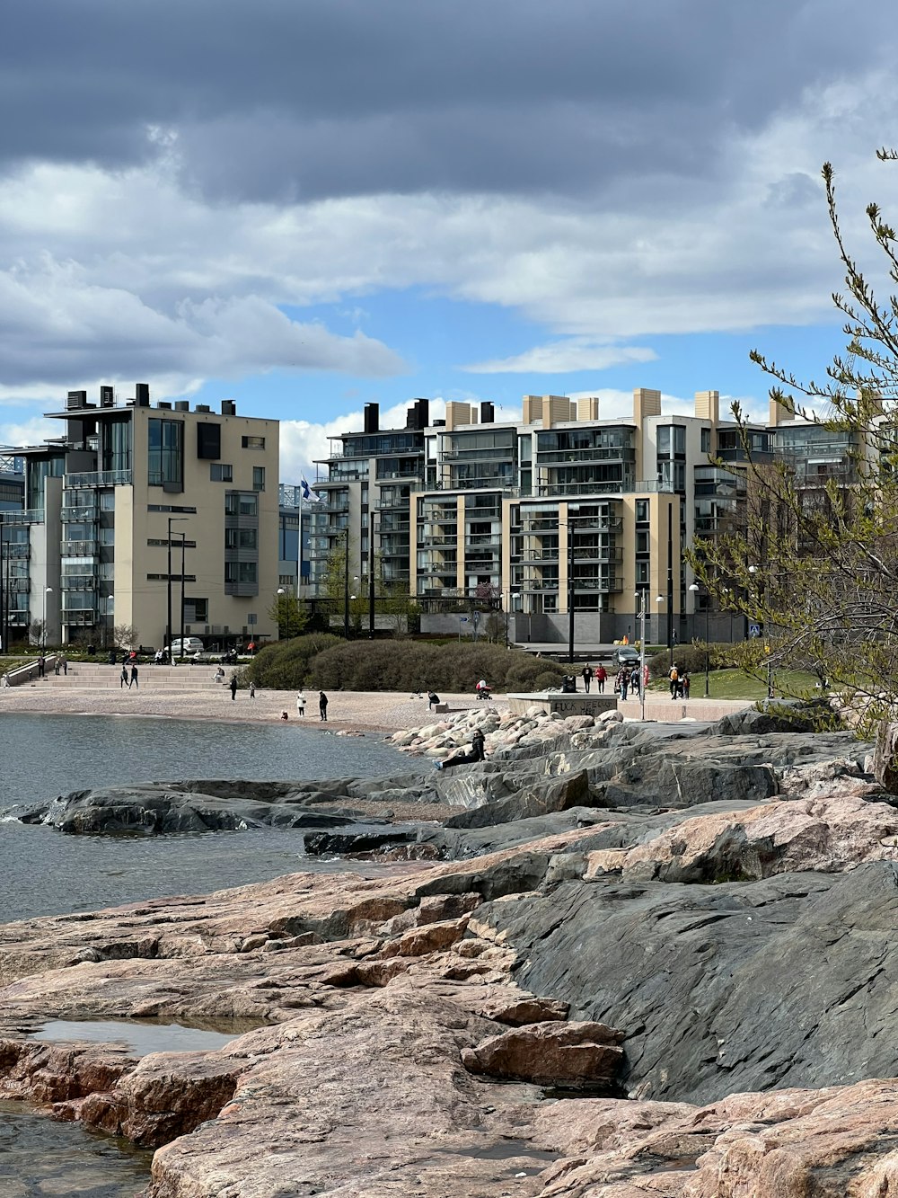 a beach with buildings and people