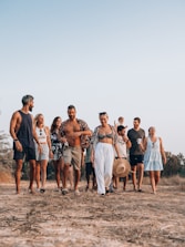 a group of people standing on a beach