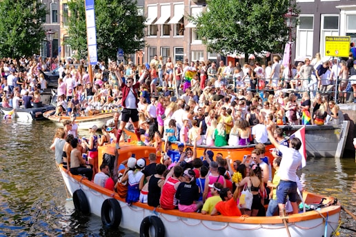 a large crowd of people on a boat