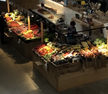 a fruit stand with fruits and vegetables
