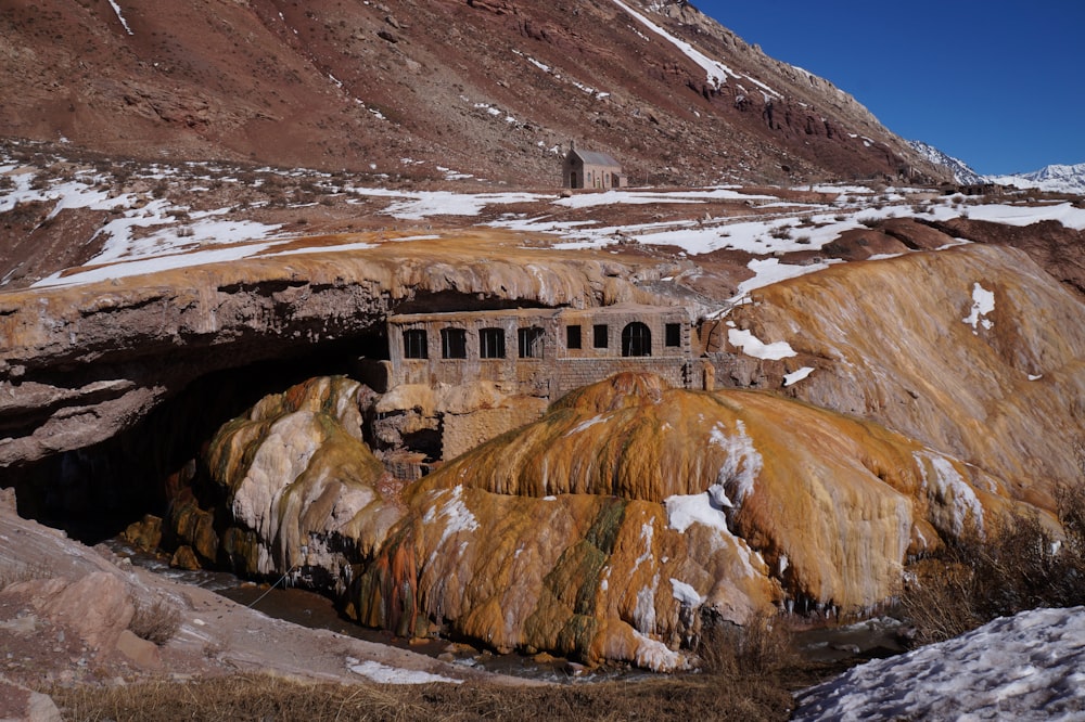 a building in a rocky area