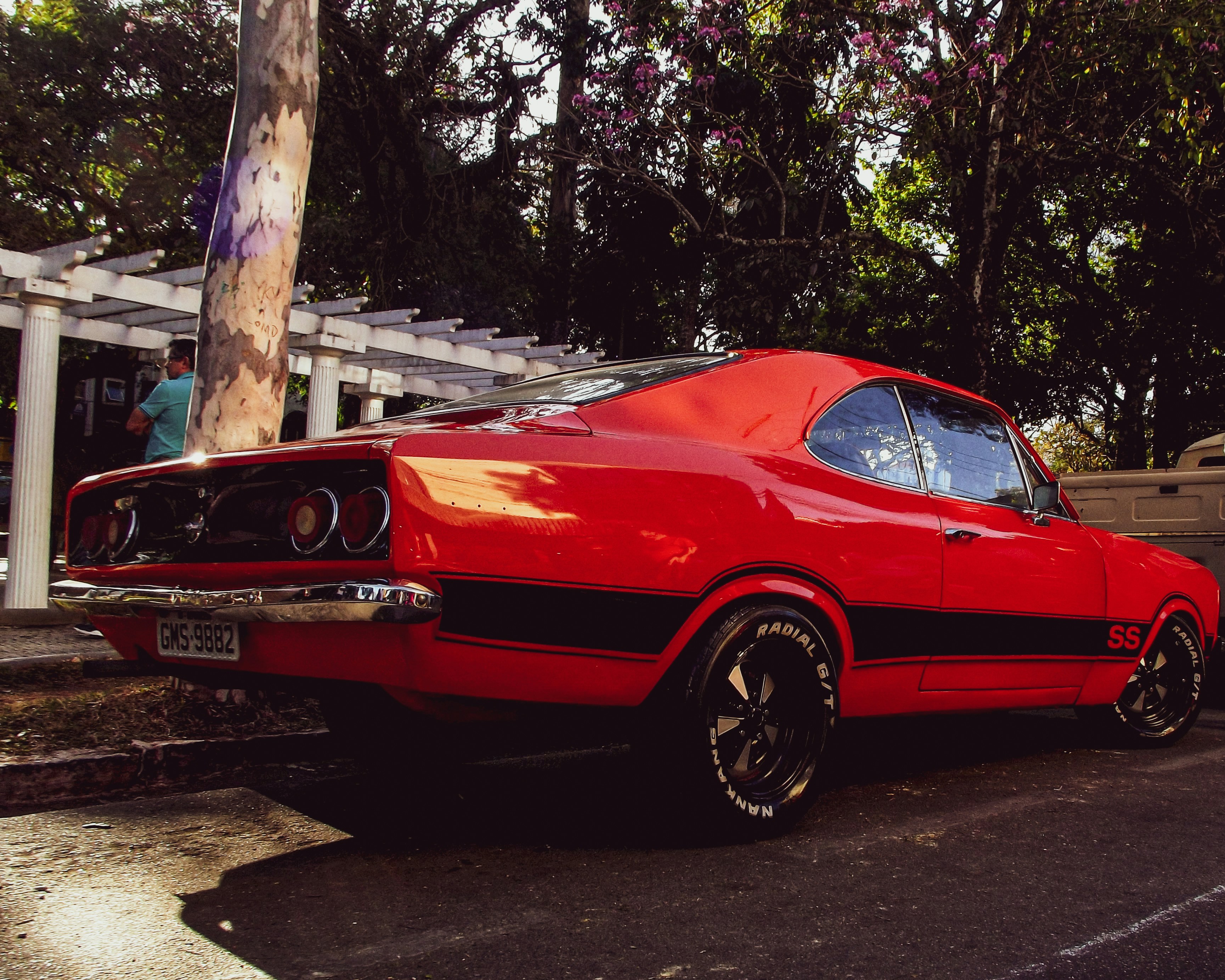 a red car parked in a parking lot