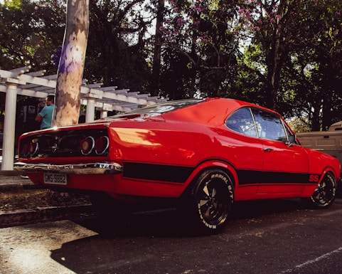 a red car parked in a parking lot