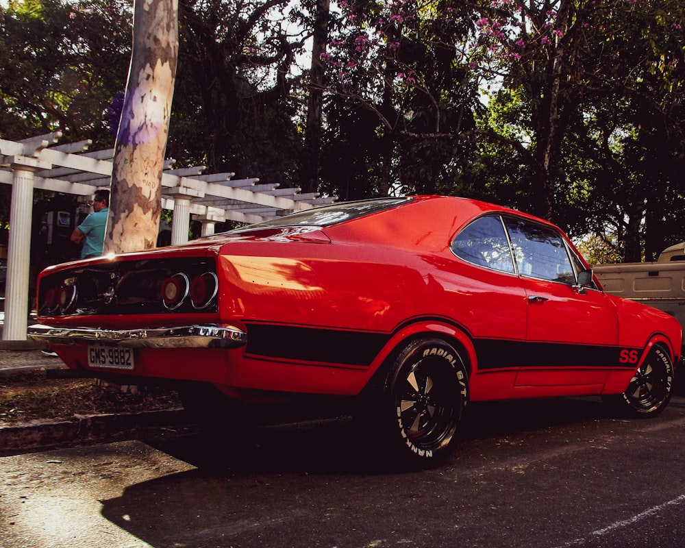 a red car parked in a parking lot