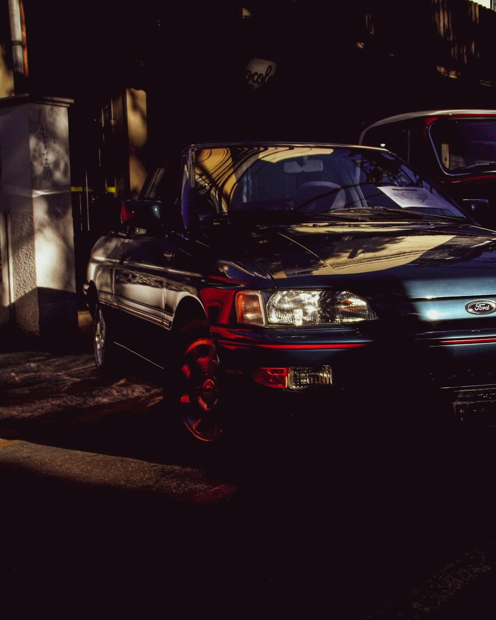 a black car parked in a garage