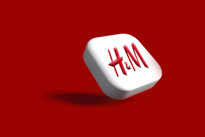Close-up of a hand clicking the bright red convert button on a minimalist black and red website interface.