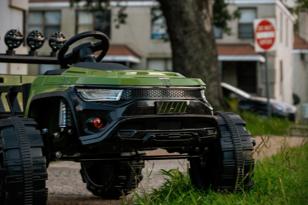 a black truck parked on grass