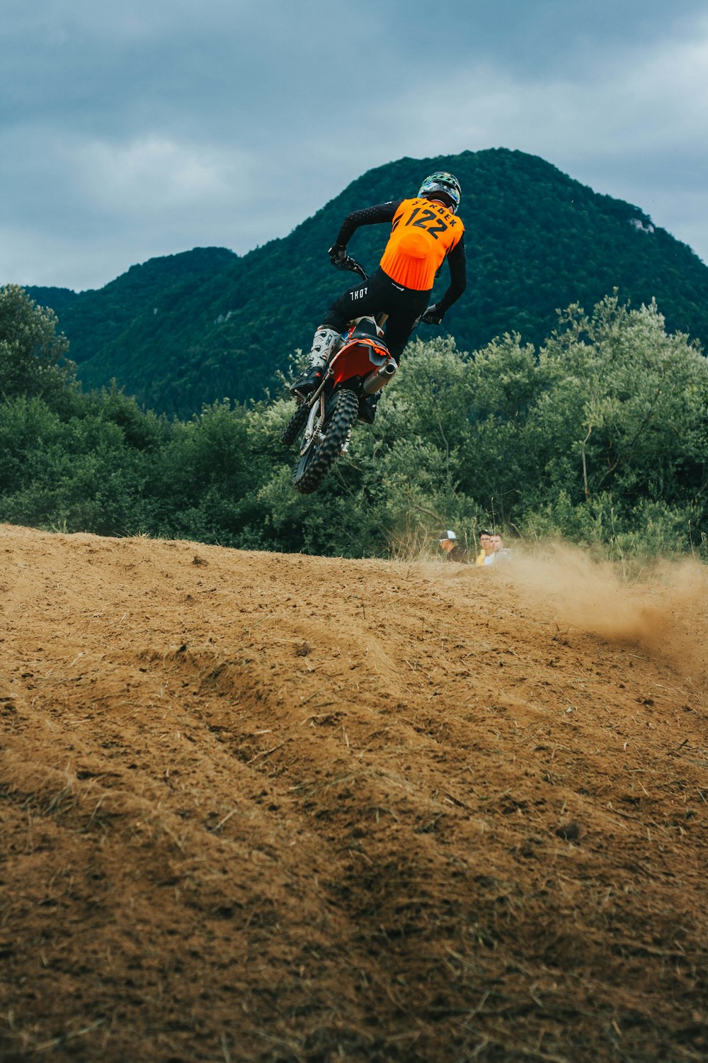 a person riding a bike on a dirt trail