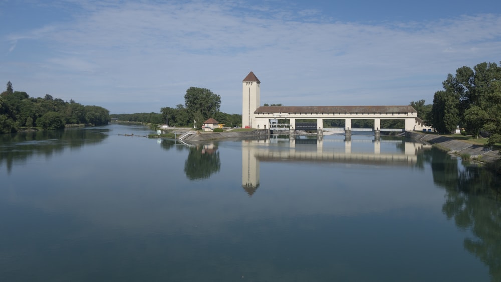 a body of water with a building in the background