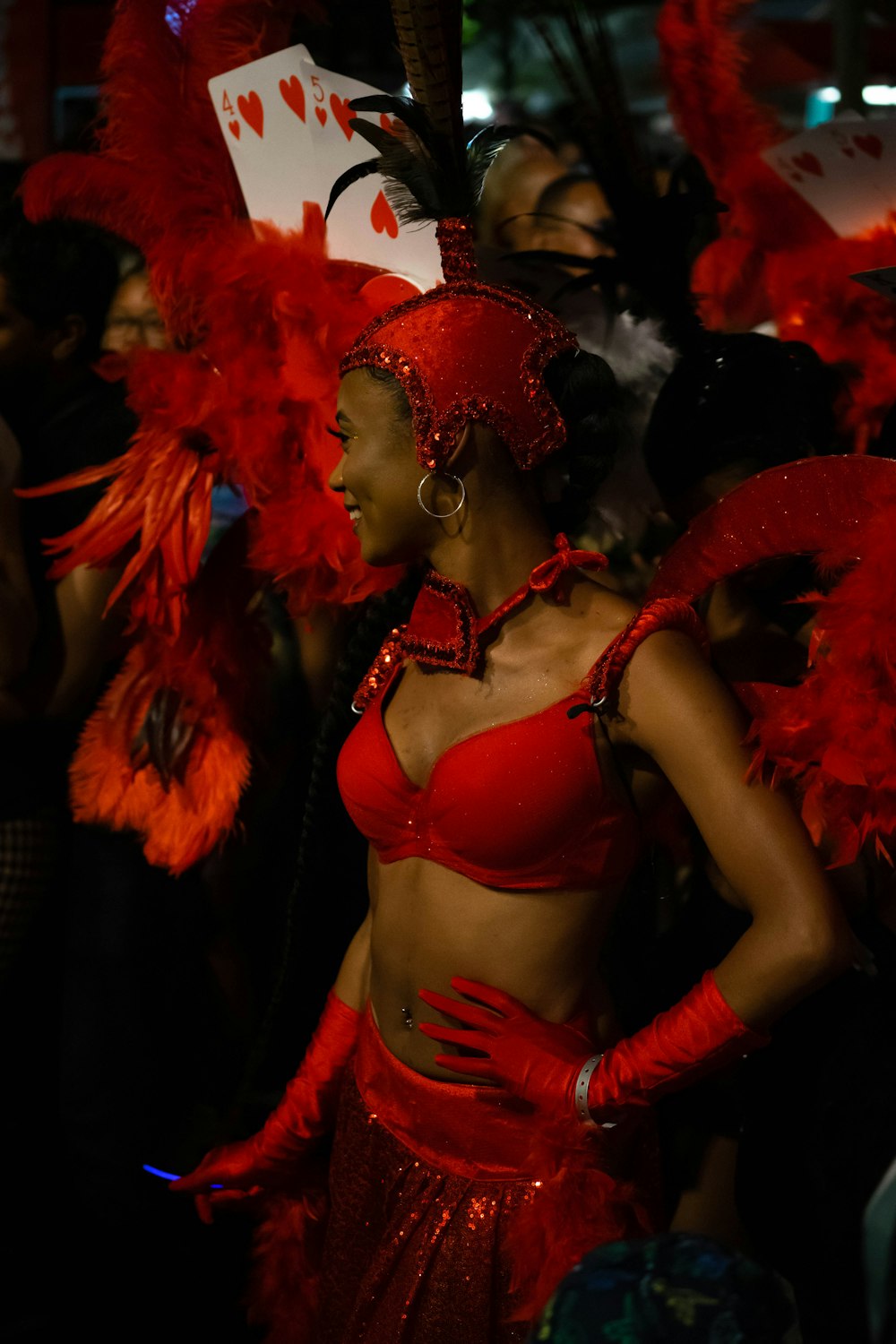 a group of women wearing red and black clothing