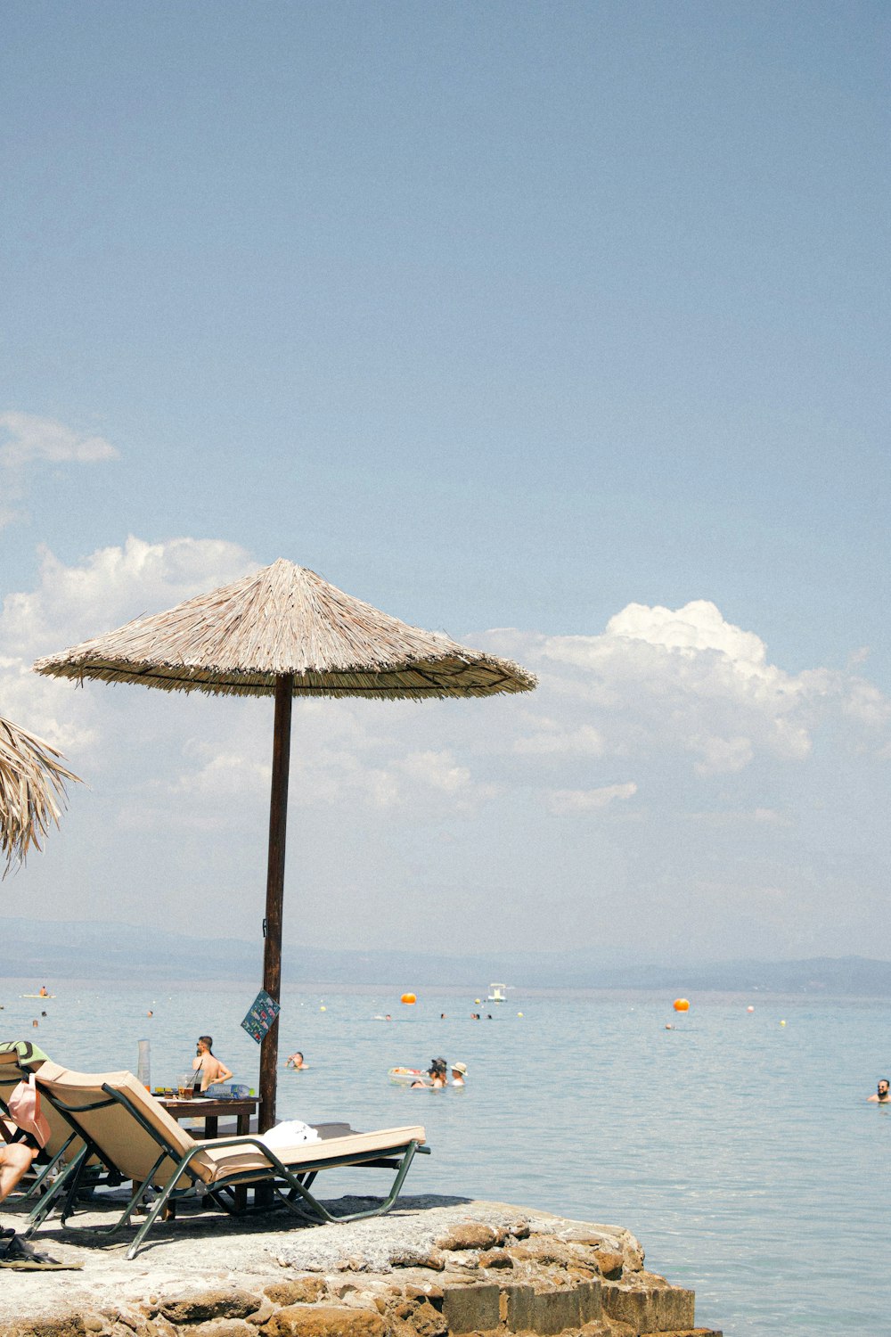 a beach with a straw umbrella