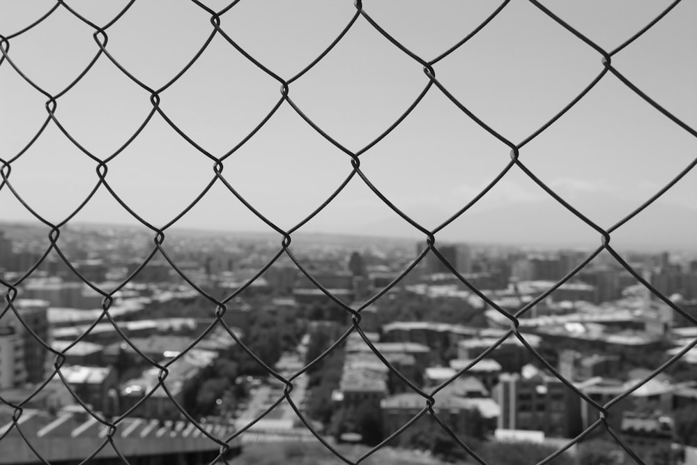 a view of a city from a fence