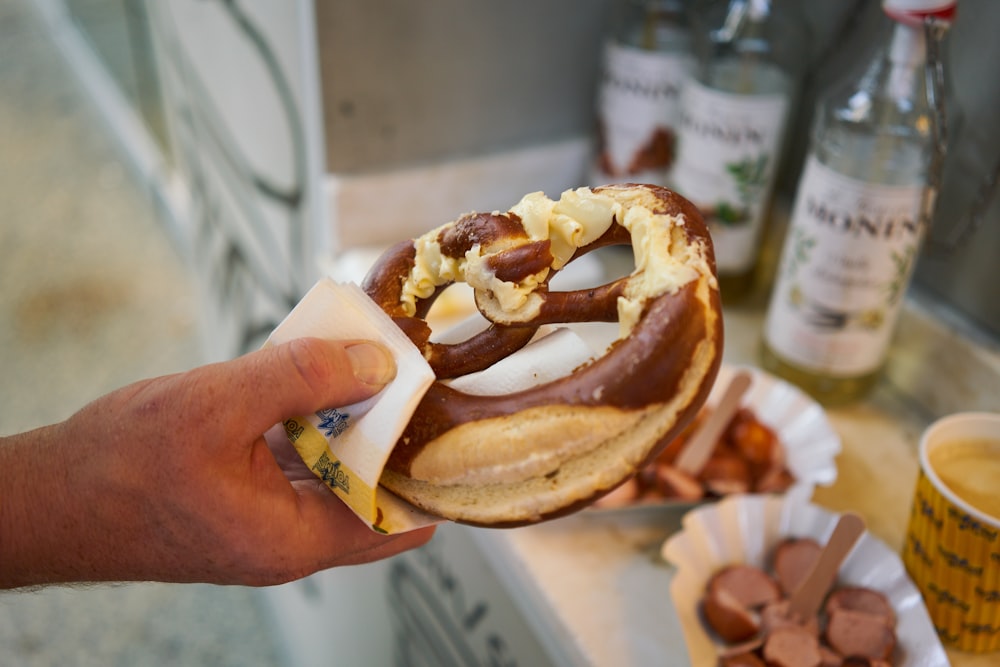 a person holding a burger