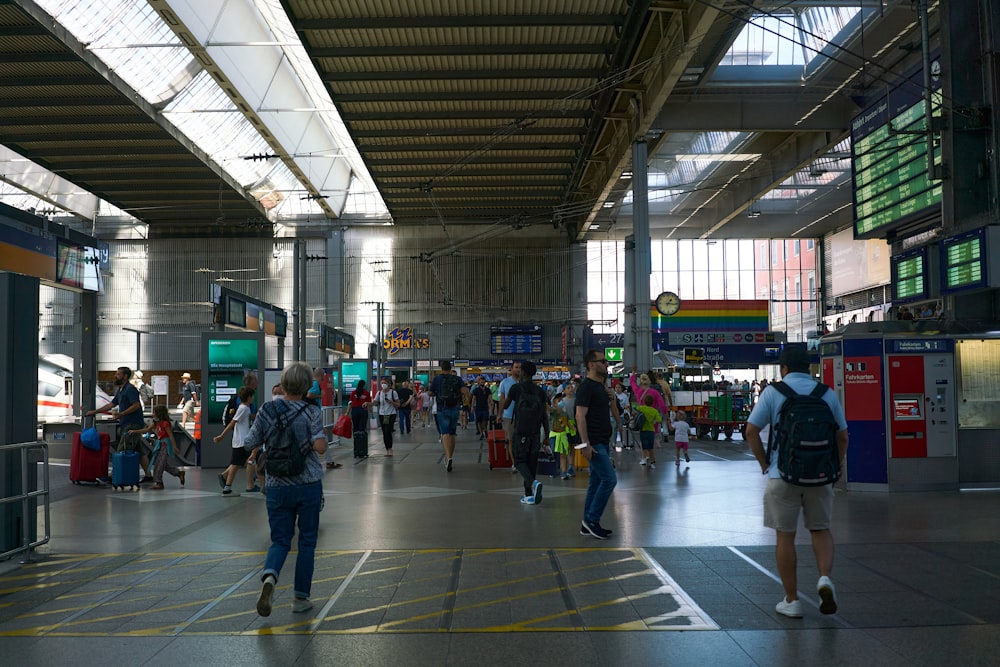 a group of people walking in a large building