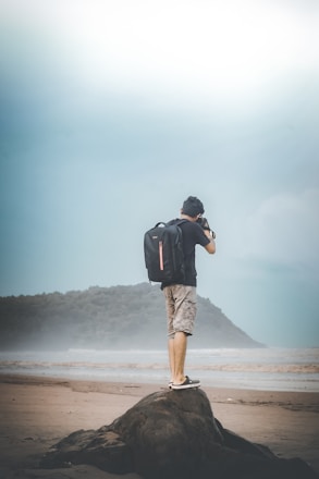 a man standing on a rock