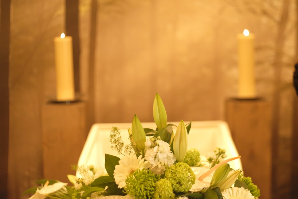 a white plate with flowers and candles