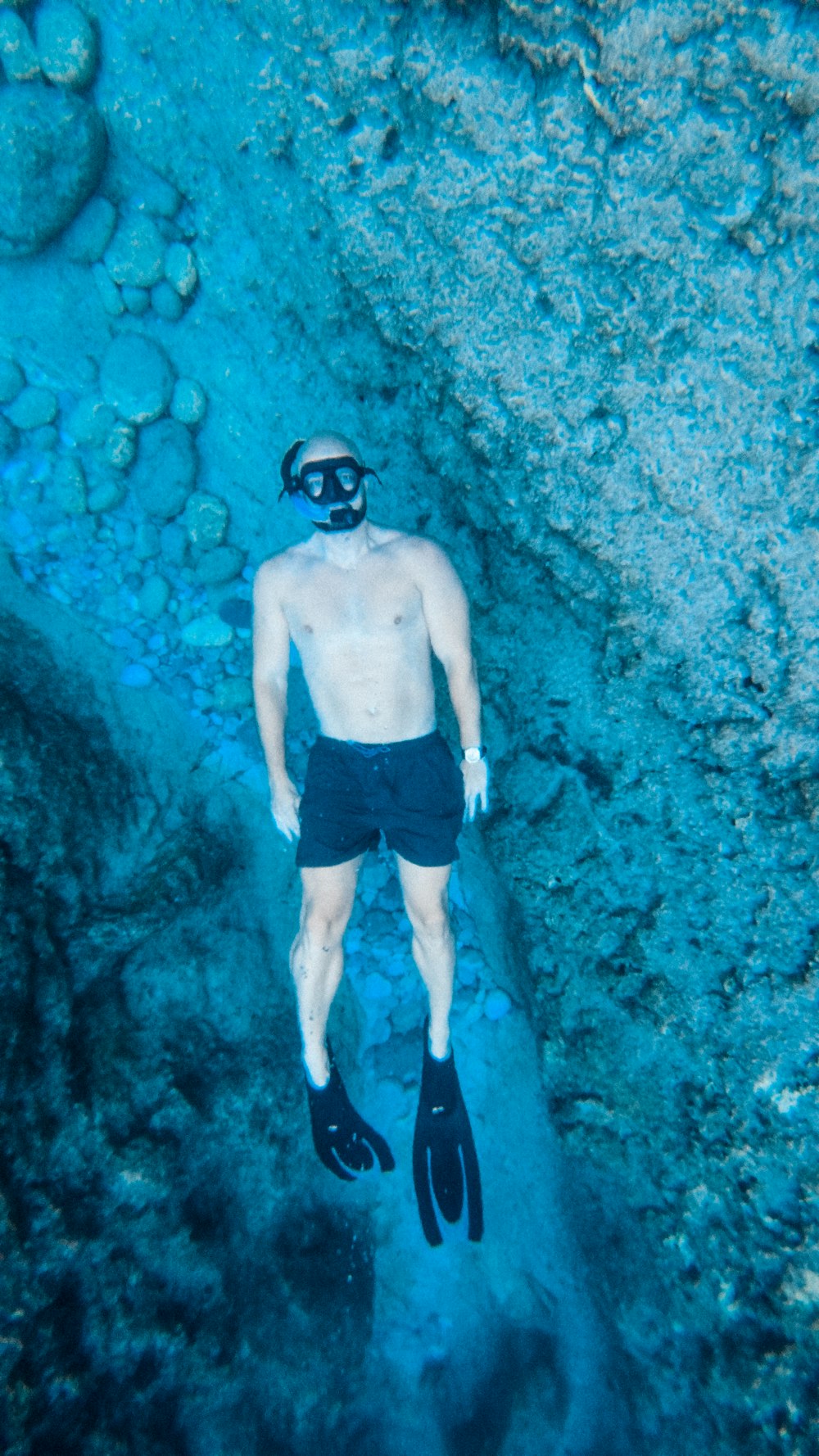 a man wearing scuba gear underwater