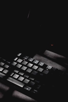 a hand holding a keyboard