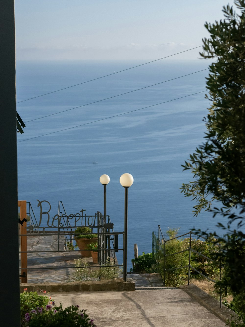 a walkway leading to a body of water