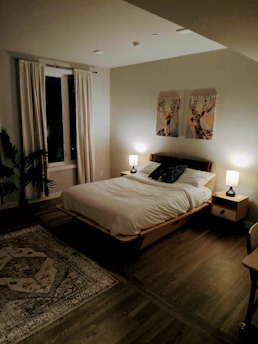 Cozy bedroom setup with wooden bed frame and bedside tables