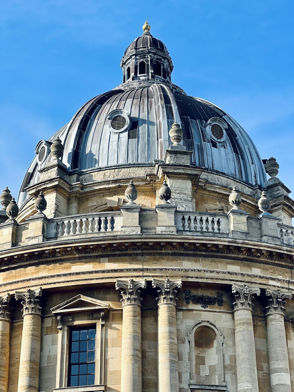 a building with a dome and pillars