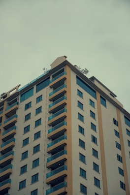 A multi-family residential building with multiple balconies and windows.