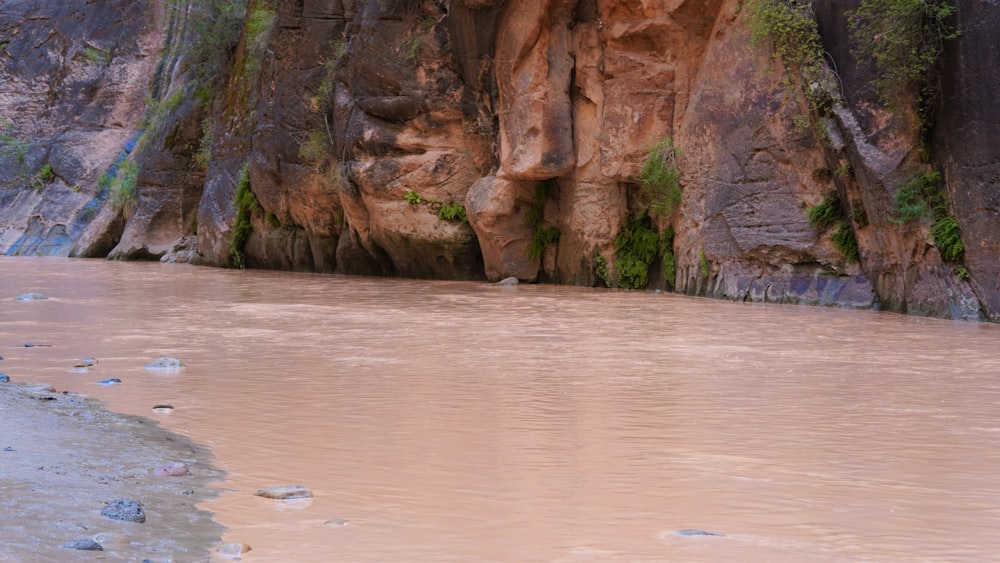 a sandy beach with large rocks