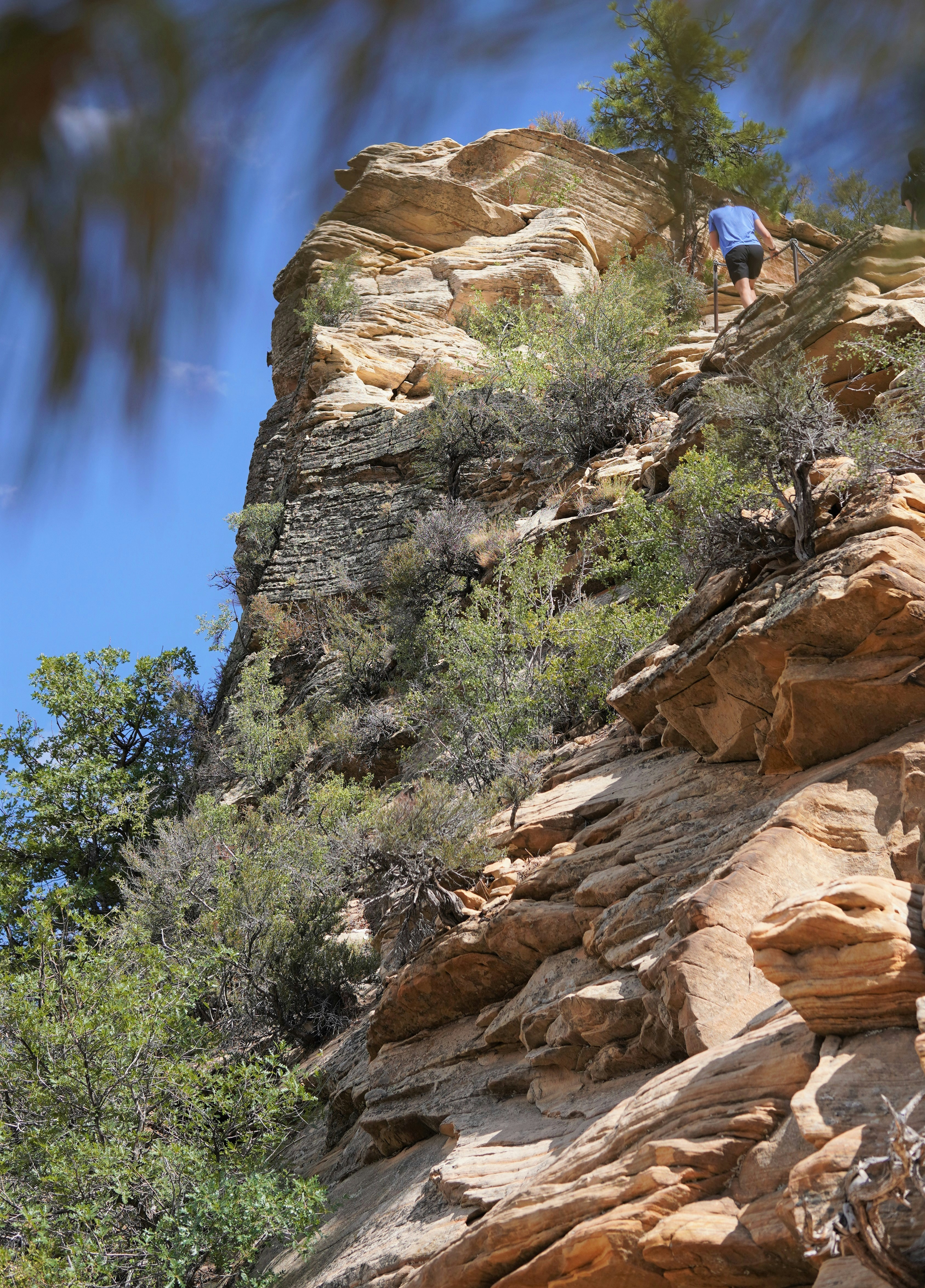 a person climbing a rocky mountain