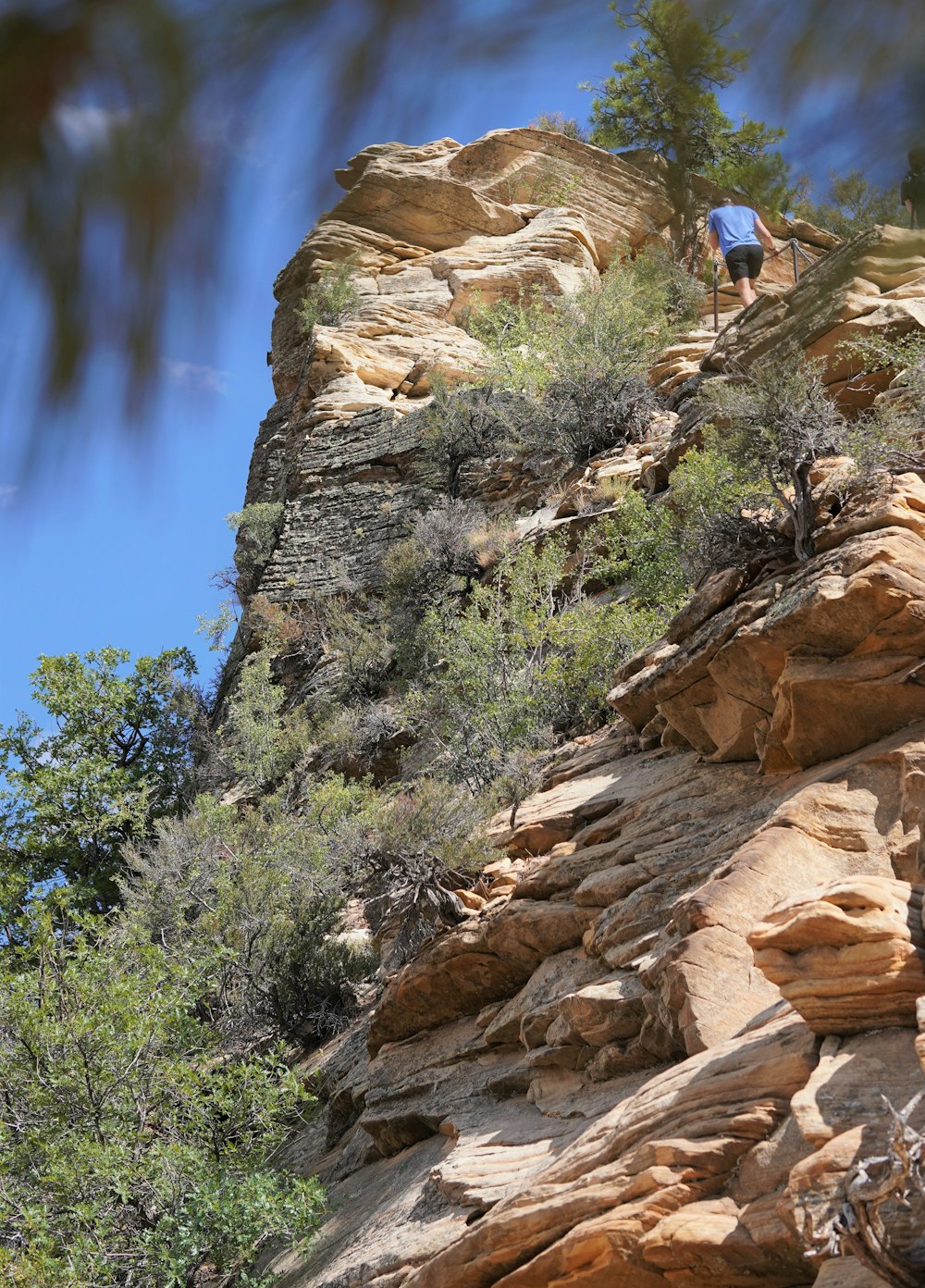 a person climbing a rocky mountain