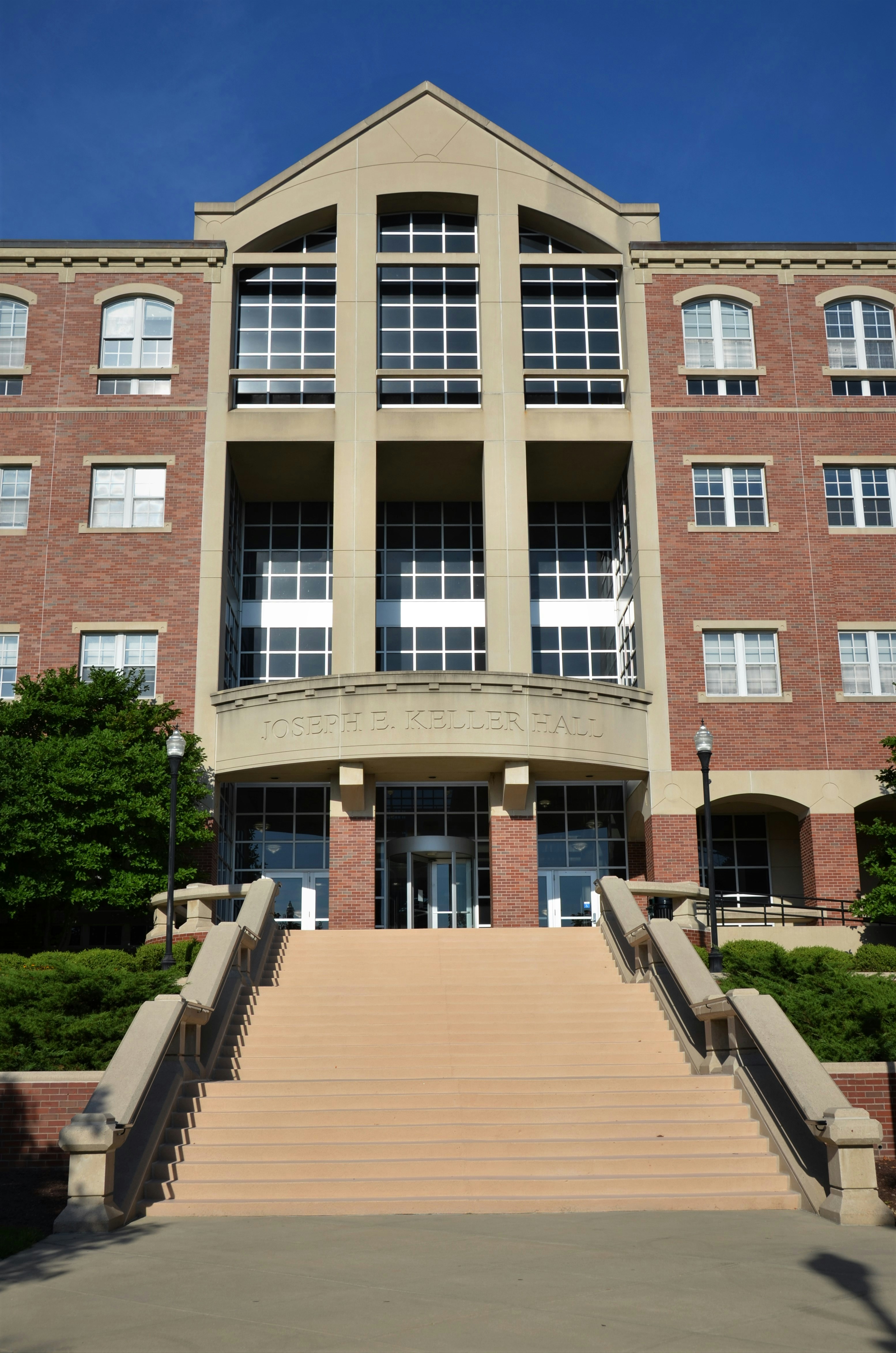 a-building-with-stairs-and-windows-photo-free-handrail-image-on-unsplash
