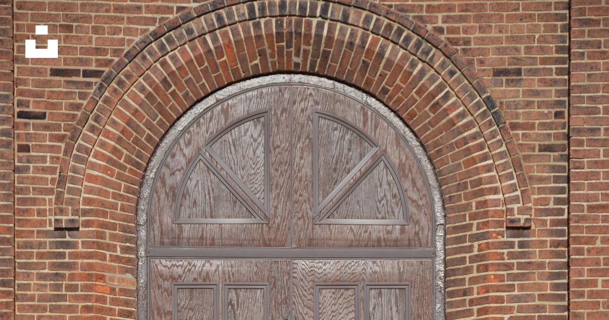 A Door In A Brick Building Photo Free Grey Image On Unsplash a-door-in-a-brick-building-photo-free-grey-image-on-unsplash