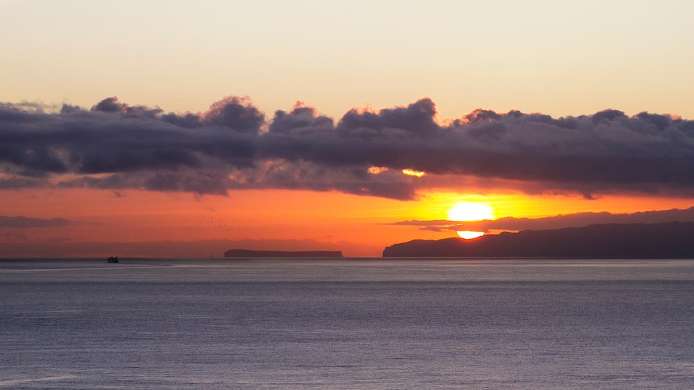 a sunset over a body of water